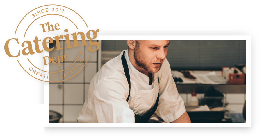 A Catering Dept chef plating up in the kitchen