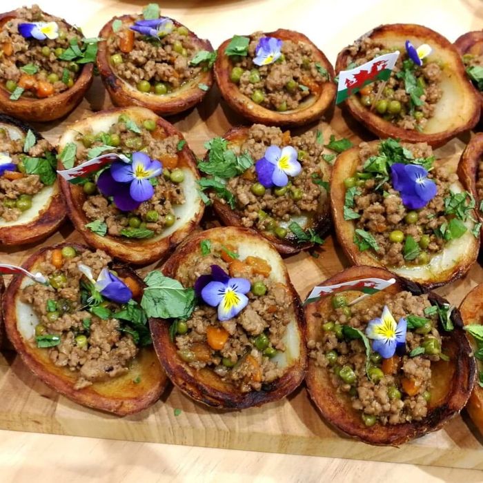 Canapé tartlets topped with edible flowers