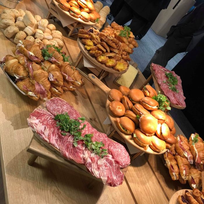 A buffet of breads, cured meats and pastries