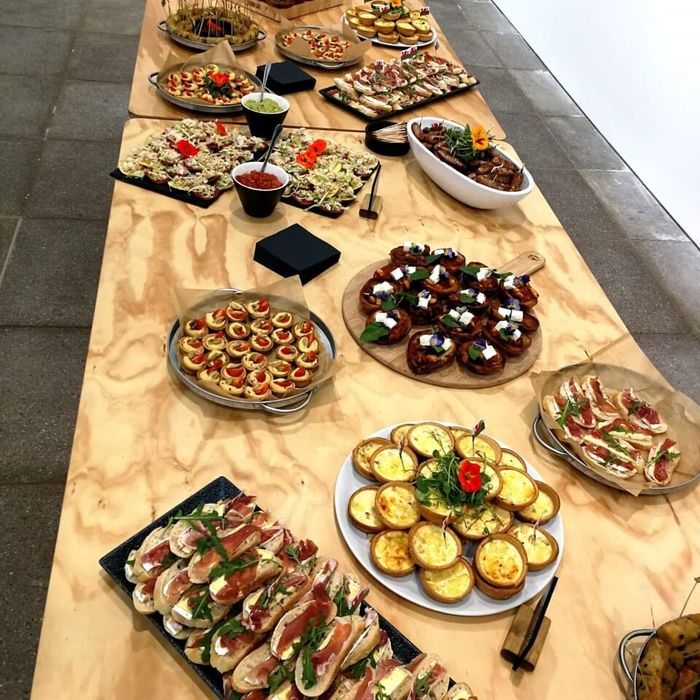 A long table of canapés and platters